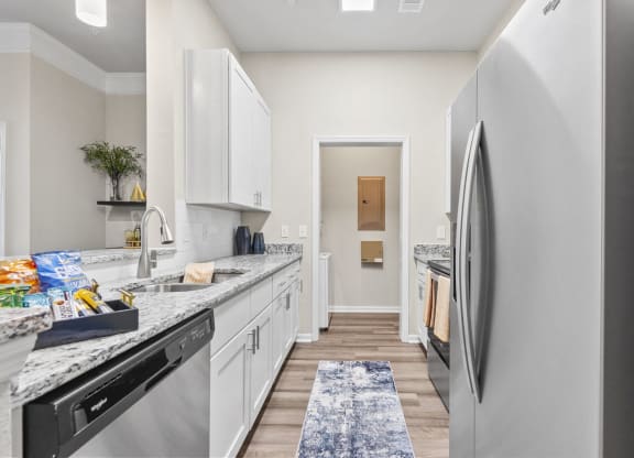 a kitchen with white cabinets at West Ashley Apartment Homes, Charleston