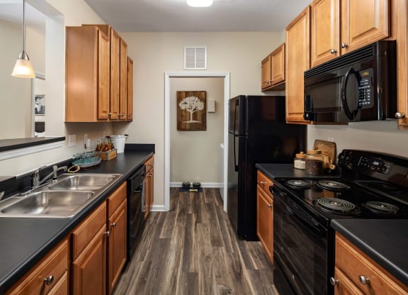 Black Kitchen Appliances at Abberly Woods Apartment Homes, North Carolina 28216