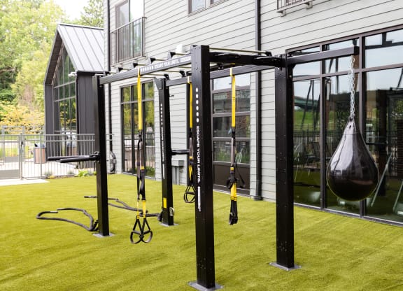 a home gym with a swing set on the lawn  at Abberly Riverwalk Apartment Homes, Nashville, 37228