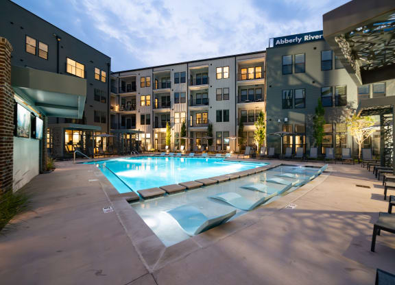 an apartment complex with a swimming pool in front of it at Abberly Riverwalk Apartment Homes, Nashville, 37228