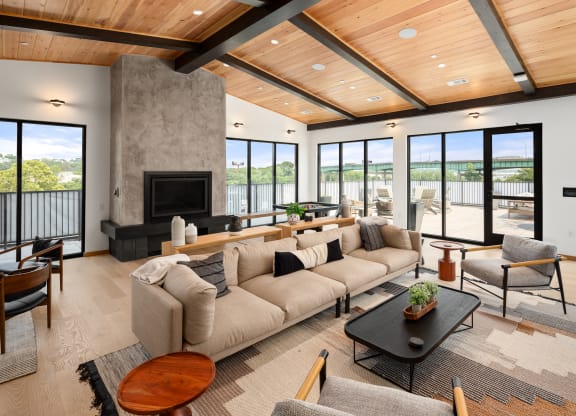 a living room with a large couch and a fireplace at Abberly Riverwalk Apartment Homes, Nashville, Tennessee
