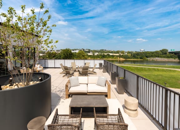 a roof deck with couches chairs and a fire pit at Abberly Riverwalk Apartment Homes, Tennessee, 37228