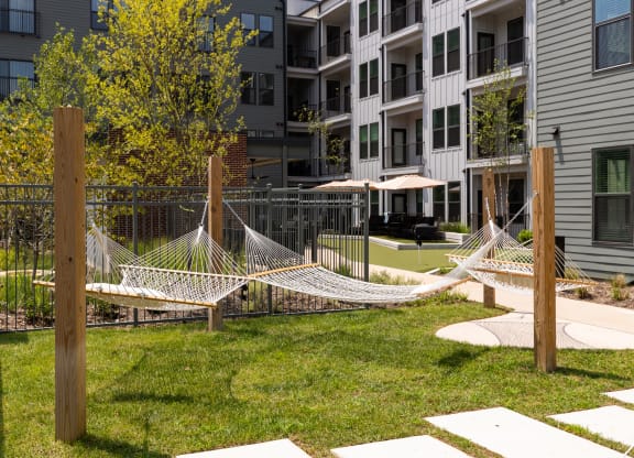 a hammock in the courtyard of an apartment building at Abberly Riverwalk Apartment Homes, Nashville, Tennessee
