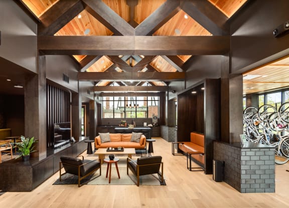 a living room filled with furniture and a large window  at Abberly Riverwalk Apartment Homes, Tennessee, 37228