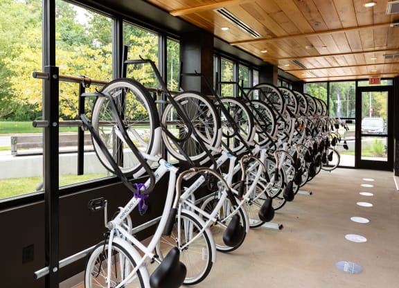 a row of bikes on a bike rack in front of a building at Abberly Riverwalk Apartment Homes, Nashville, TN, 37228