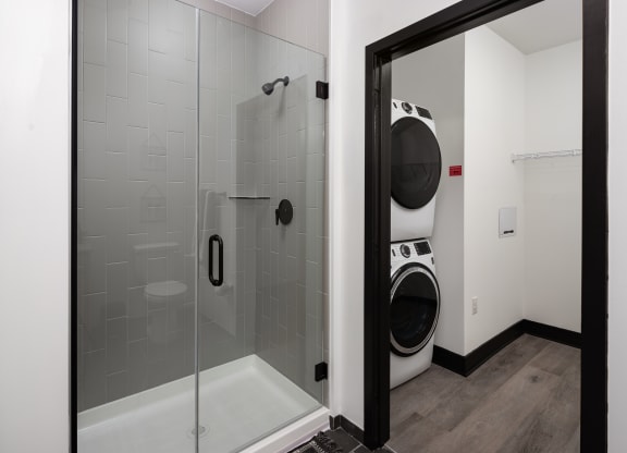 a laundry room with a washer and dryer  at Abberly Riverwalk Apartment Homes, Nashville, TN