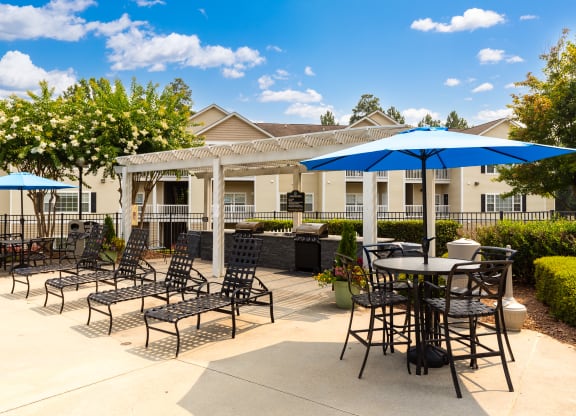 Poolside patio with grills at Abberly Grove Apartment Homes, Raleigh, NC