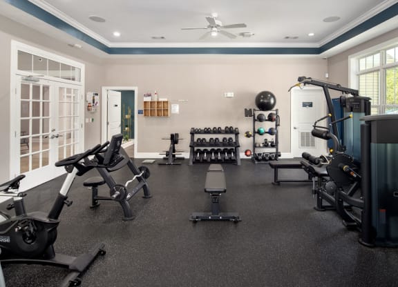 a home gym with exercise equipment and weights