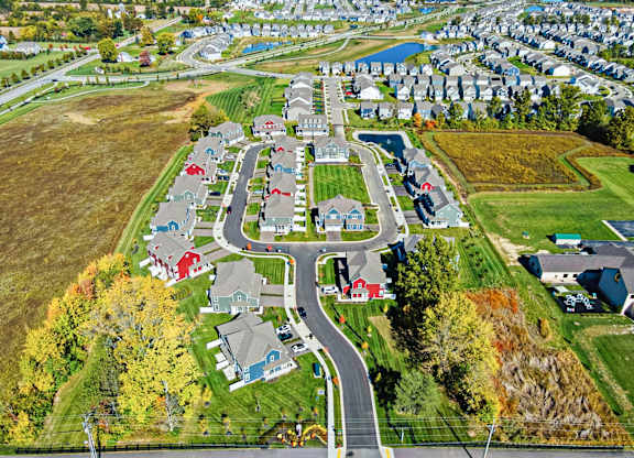 A suburban neighborhood with houses and a park.