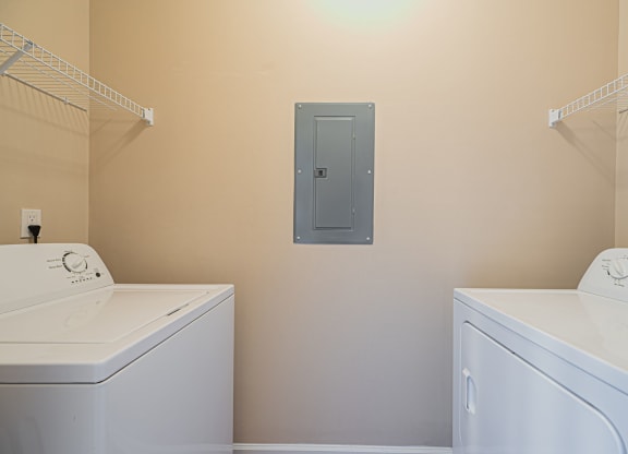 a washer and dryer in a laundry room with a door