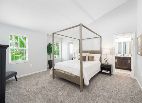 a bedroom with a four poster bed