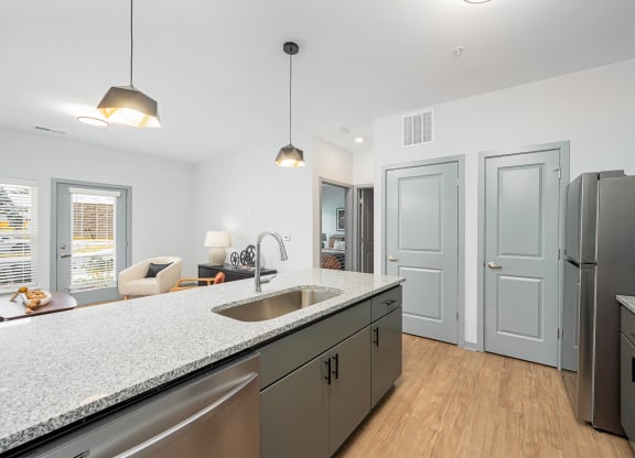 a kitchen with stainless steel appliances and a counter top