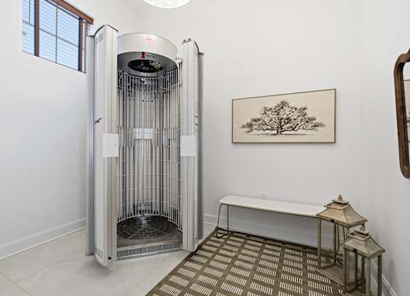 A room with a large oven and a bench.