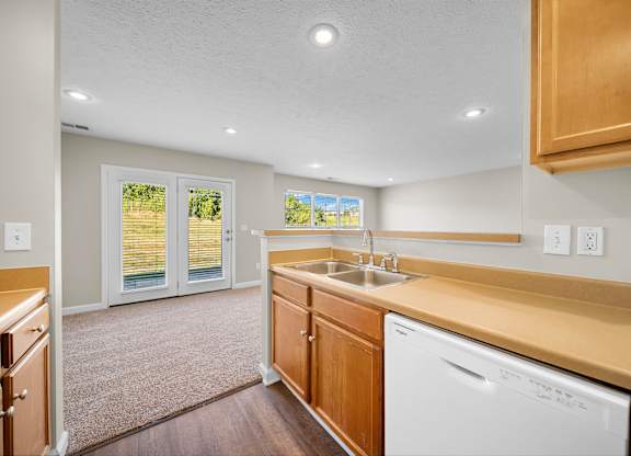 A kitchen with a washer and dryer built in.