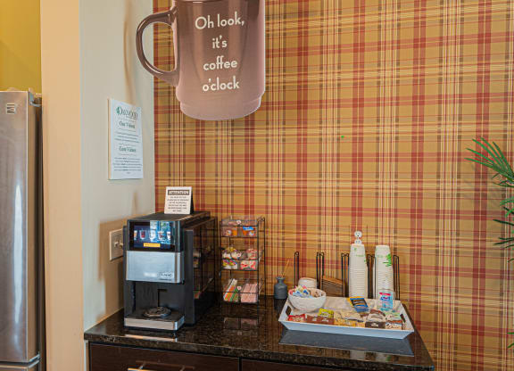 a coffee shop with a coffee cup on the wall