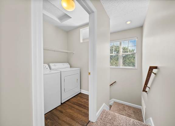A laundry room with a washer and dryer.