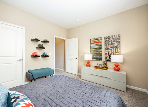a bedroom with a bed and a closet