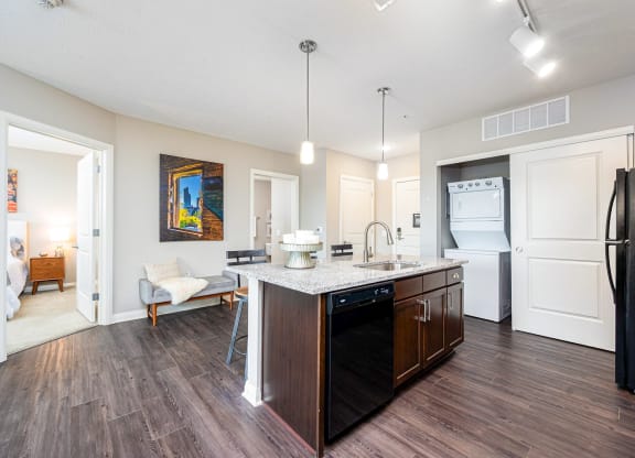 a kitchen with a island and a refrigerator