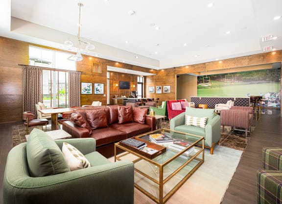 a living room with couches and chairs and a table