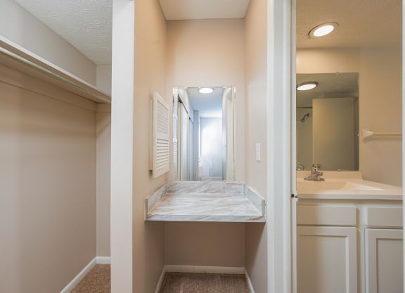 an empty bathroom with a sink and a mirror
