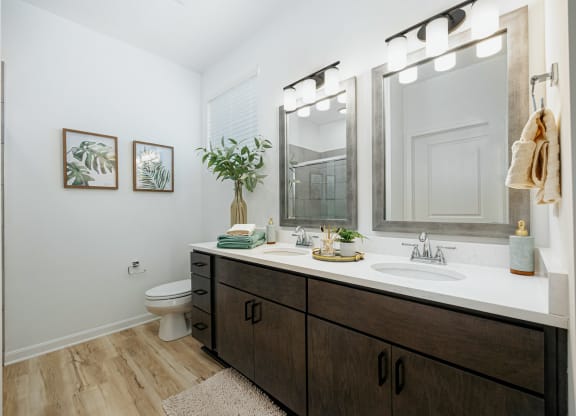 a bathroom with a large mirror and a sink