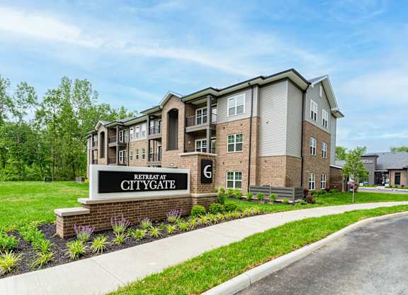 A building with a sign that says "Retreat at Citygate".