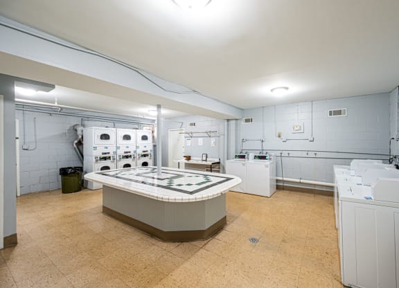 a kitchen with white appliances and a counter top