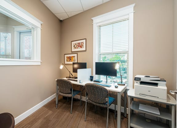 a home office with a desk and a computer