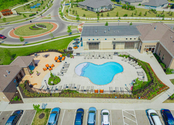 an aerial view of a large swimming pool in a parking lot