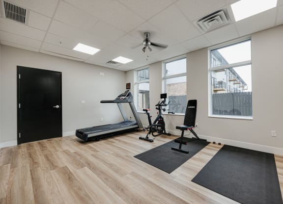 the heights gym with exercise equipment and windows