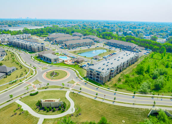an aerial view of a city with roads and buildings