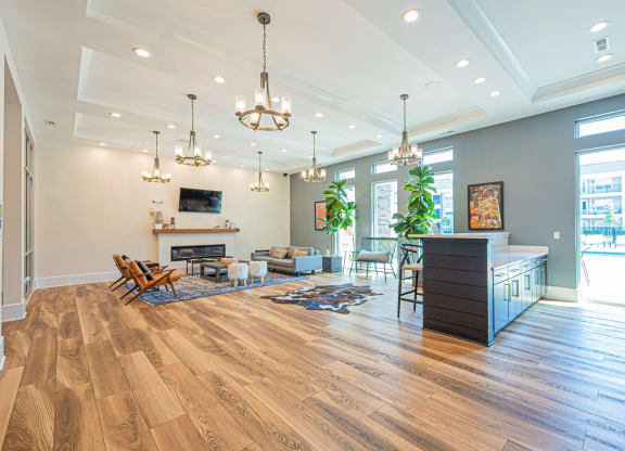 a living room with a fireplace and a table and chairs
