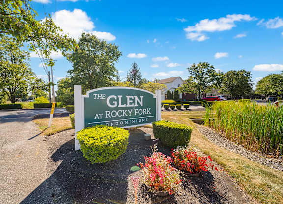 A sign for The Glen at Rocky Fork is displayed in front of a landscaped area.