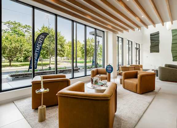 A room with a long table and chairs with a sign that says