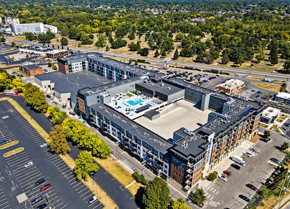 A large building with a pool in the middle of it.