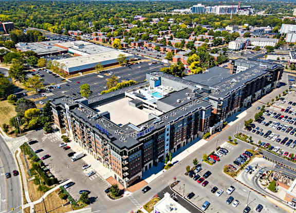 A large building with a parking lot in front of it.
