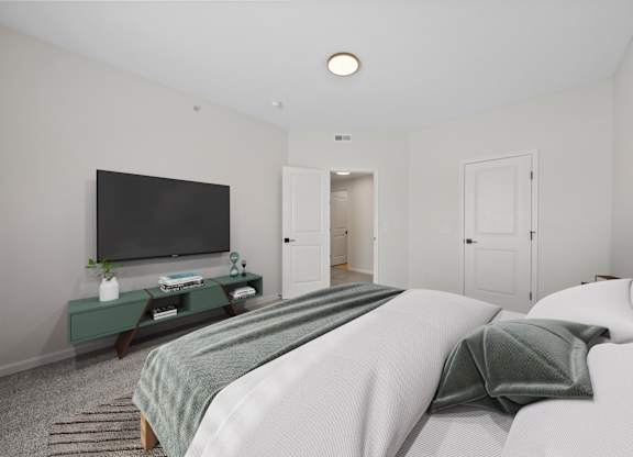 A bedroom with a bed, a television, and a cabinet.