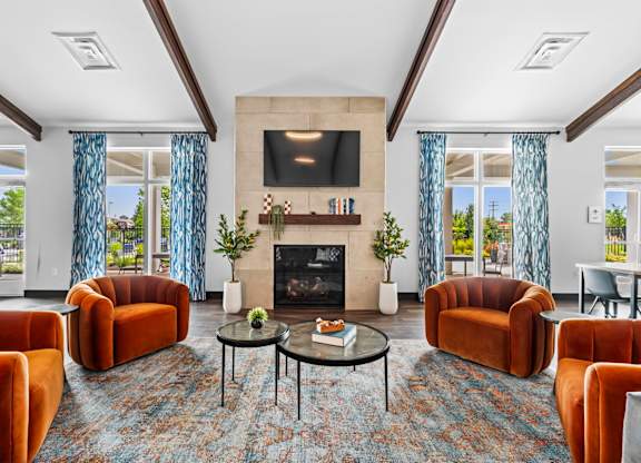 A living room with a fireplace and a television.