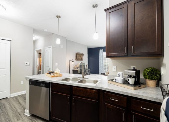 spacious kitchen with stainless steel appliances at the district flats apartments in lenexa