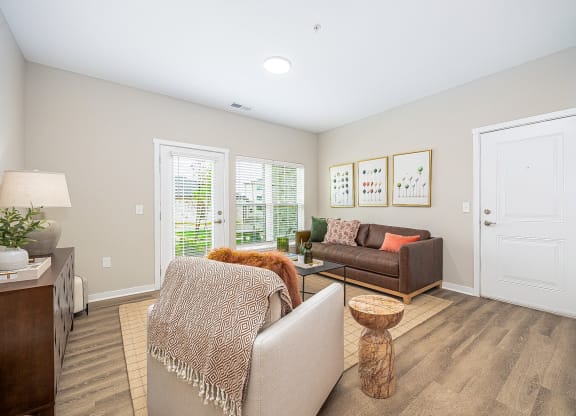 a living room with two couches and a table