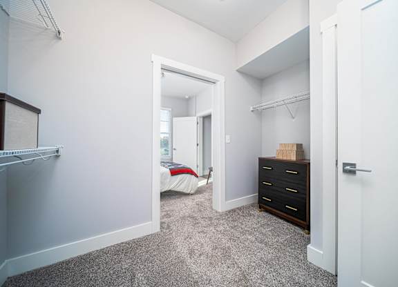 a bedroom with a closet and a bed in it