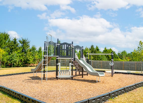 a playground with slides on a sunny day
