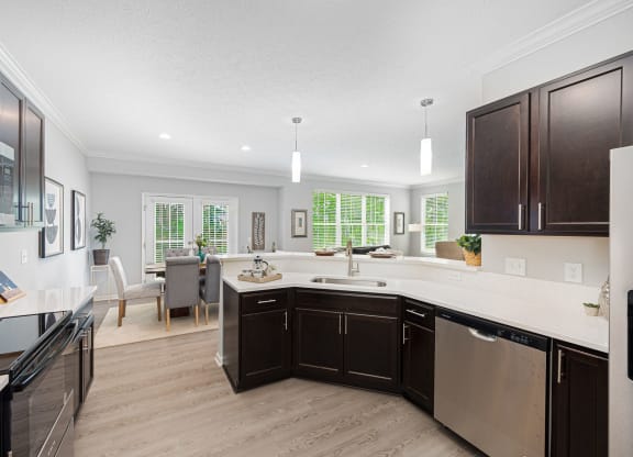 a kitchen and living room with a large counter top