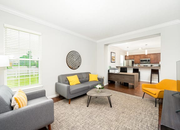 a living room with couches and a table