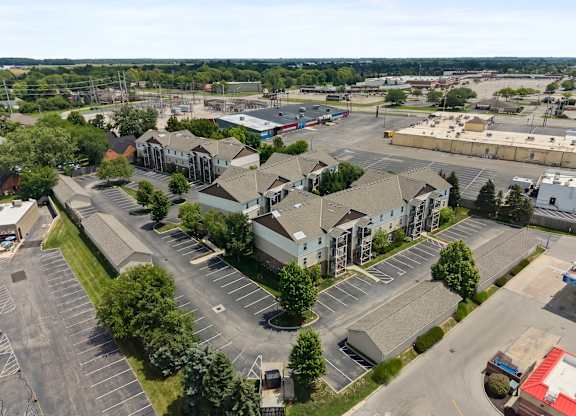 A parking lot with a building in the background.