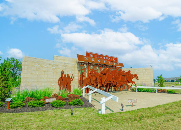 a mural of cattle on the side of a building