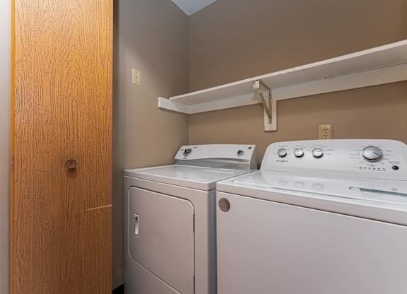 A laundry room with a washer and dryer.