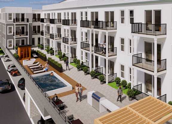 A modern apartment complex with a pool and balconies.