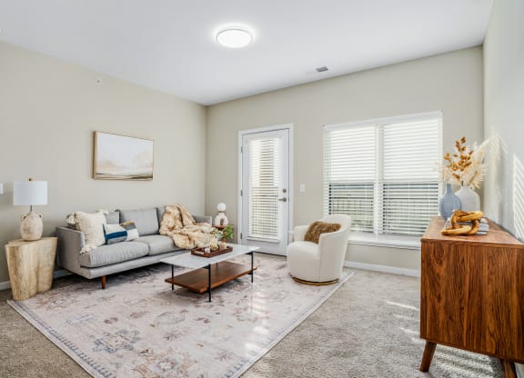 a living room with a couch and a chair
