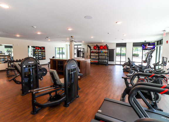 a room filled with lots of different types of exercise equipment